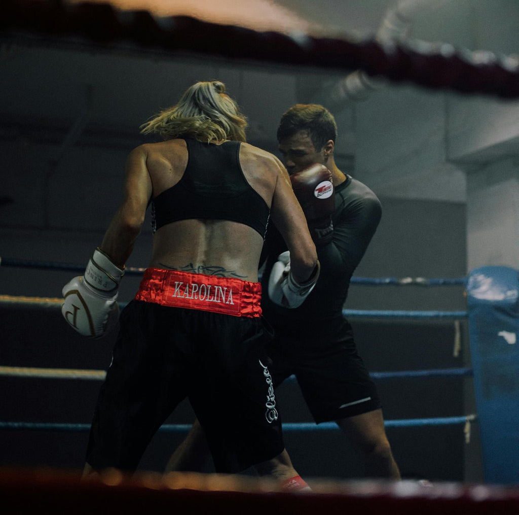 bilde av to mma utøvere i ringen